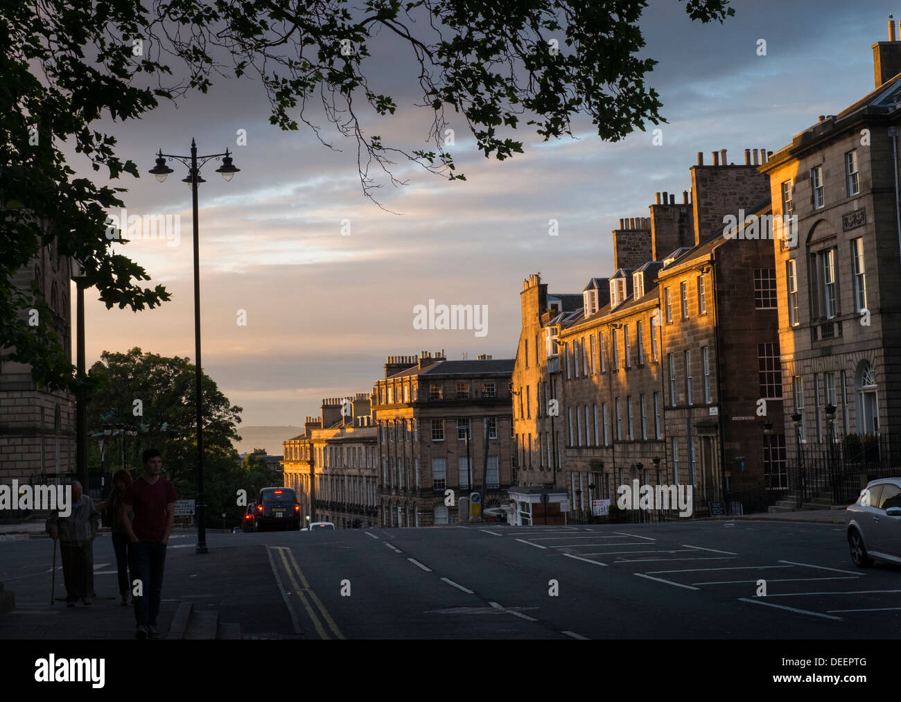 Sun setting on flats in North Charlotte Street, Edinburgh. Stock Photo