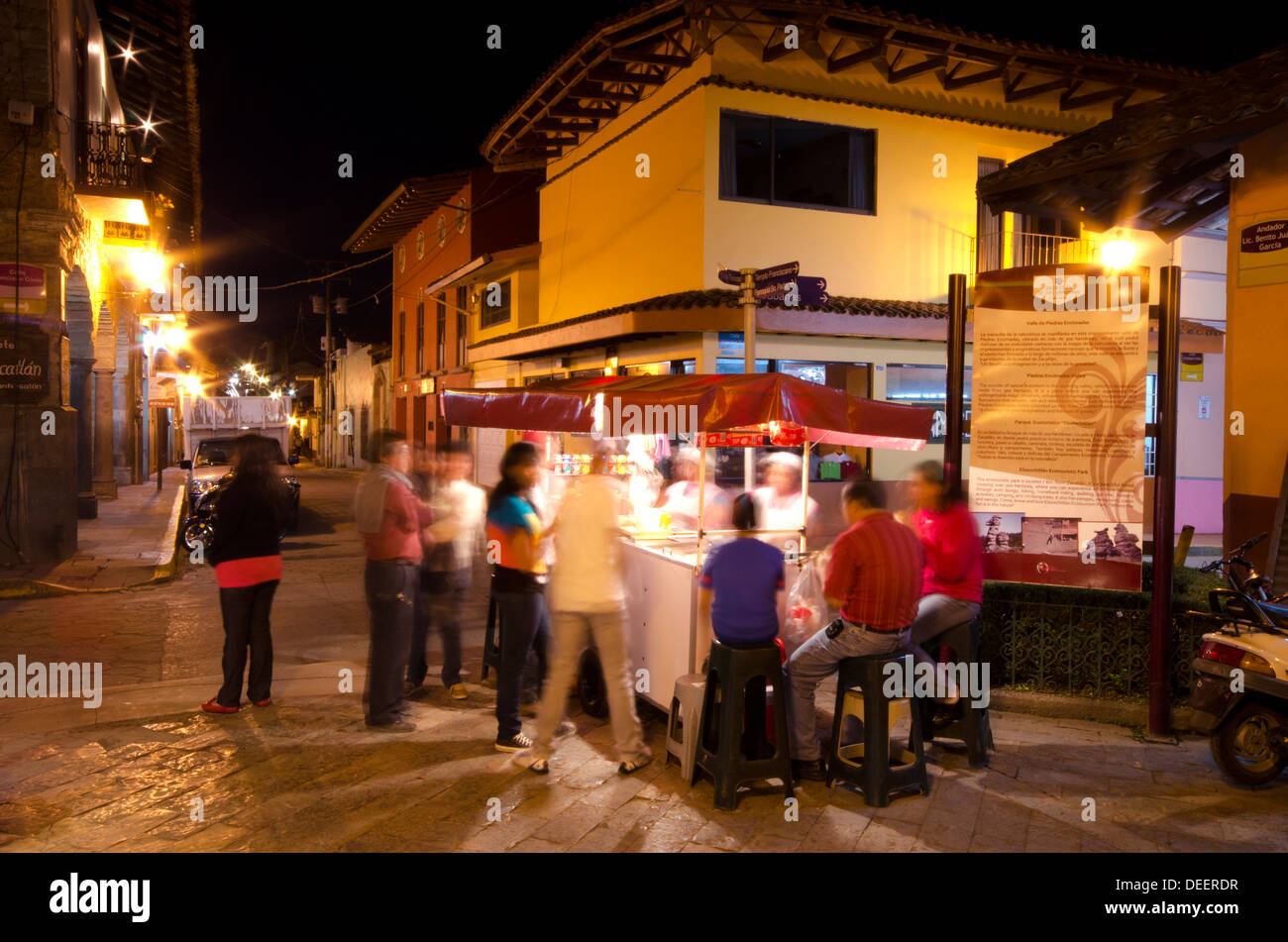 Busy food stall at night in the centre of Zacatlan in Central Mexico Stock Photo