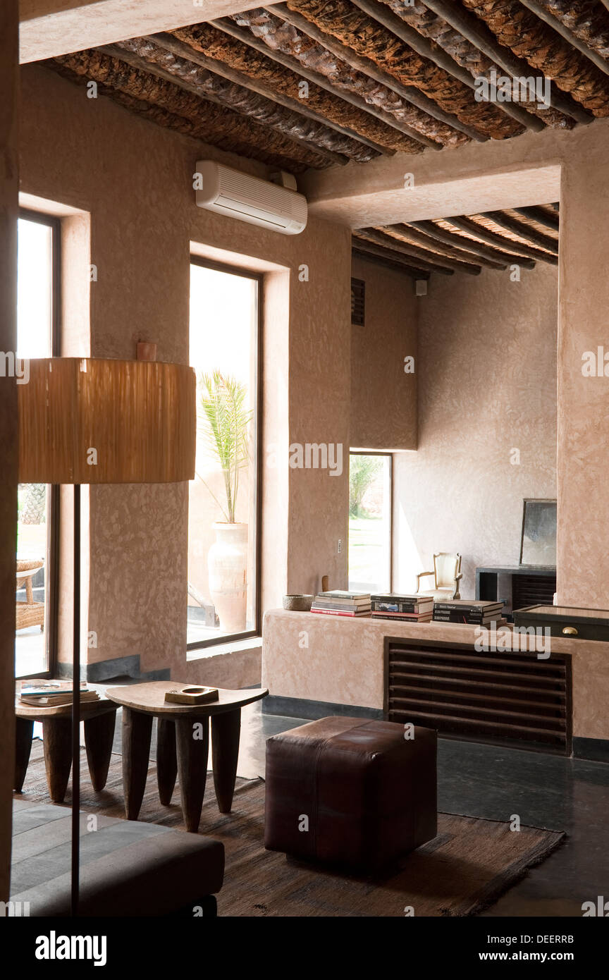 Seating area with lamp and side tables Moroccan new-build with interior design Romain Michel-Meniere Stock Photo