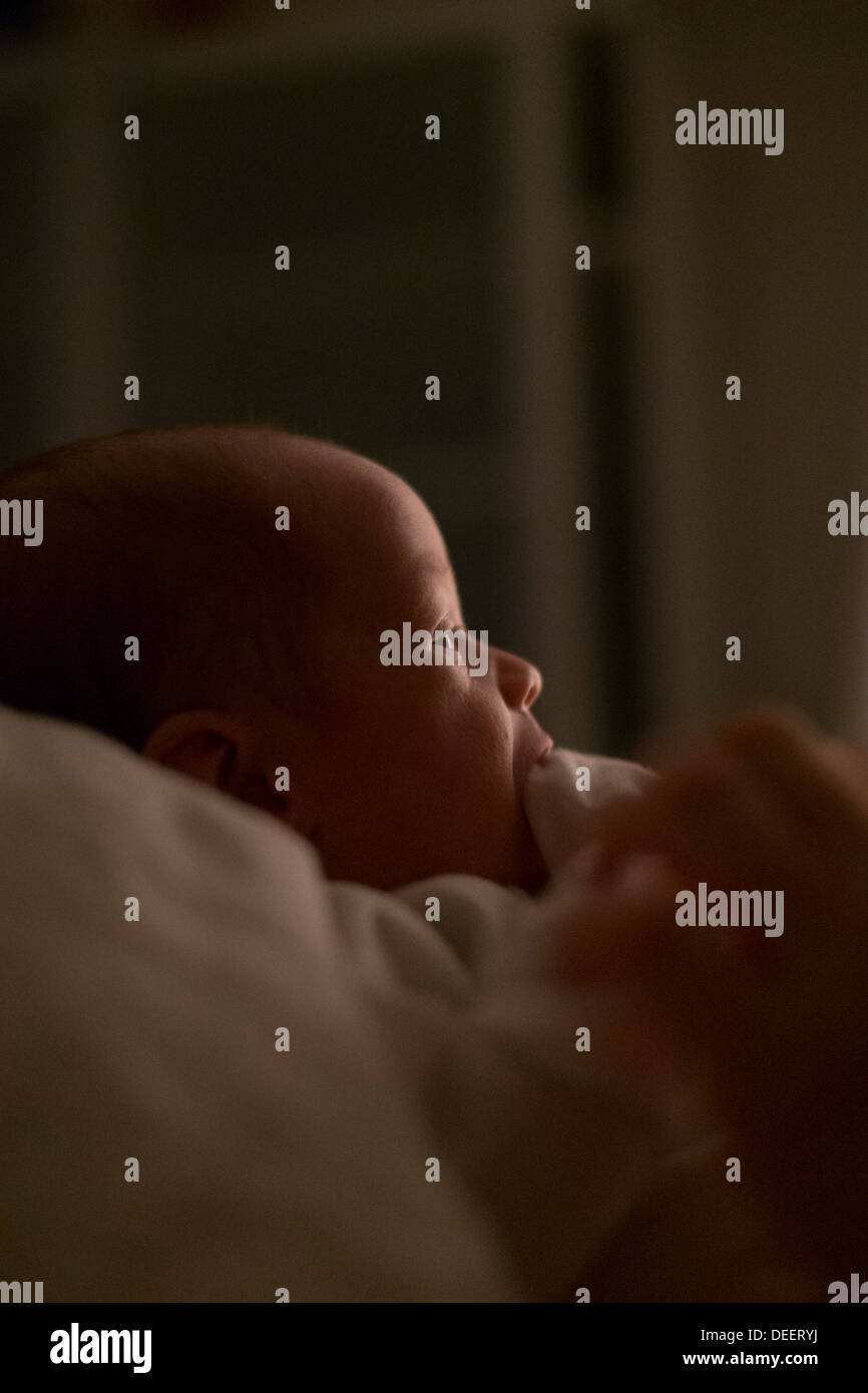 A newborn baby boy awake at night. Stock Photo
