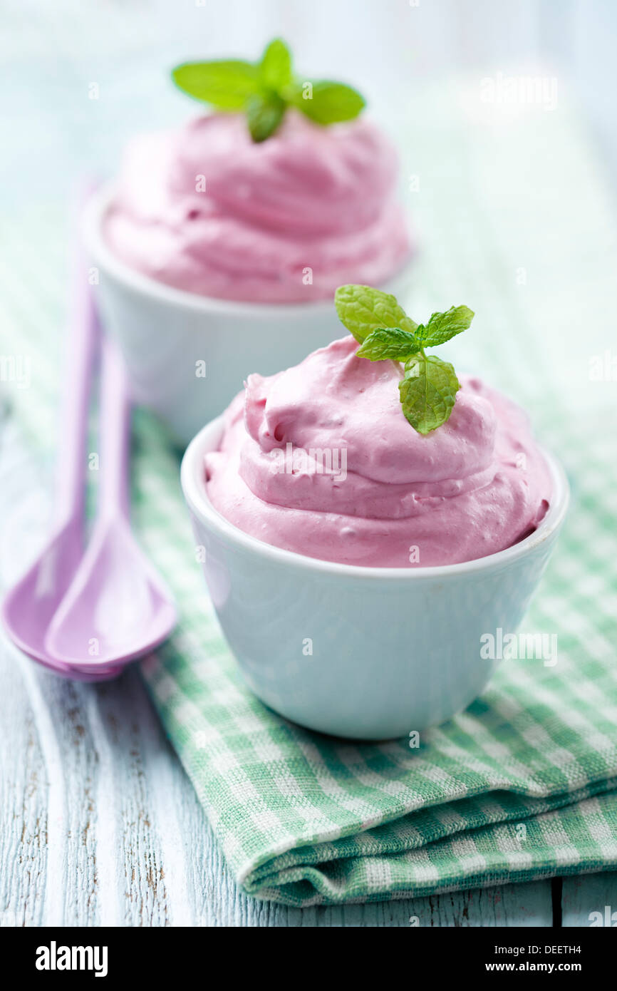 fresh berry mousse with mint as garnish Stock Photo