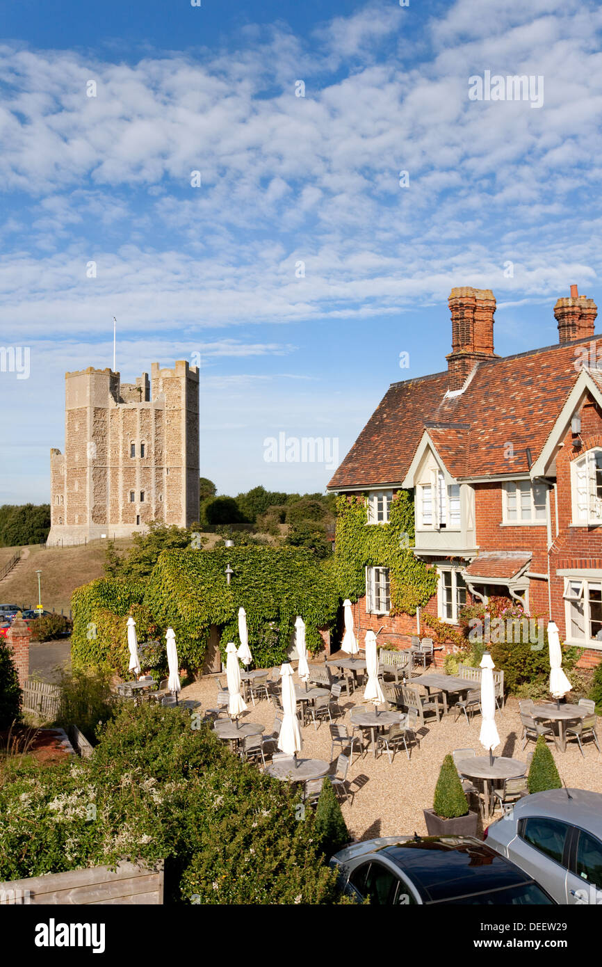 The Crown and Castle Hotel with the castle in the background, Orford, Suffolk UK Stock Photo