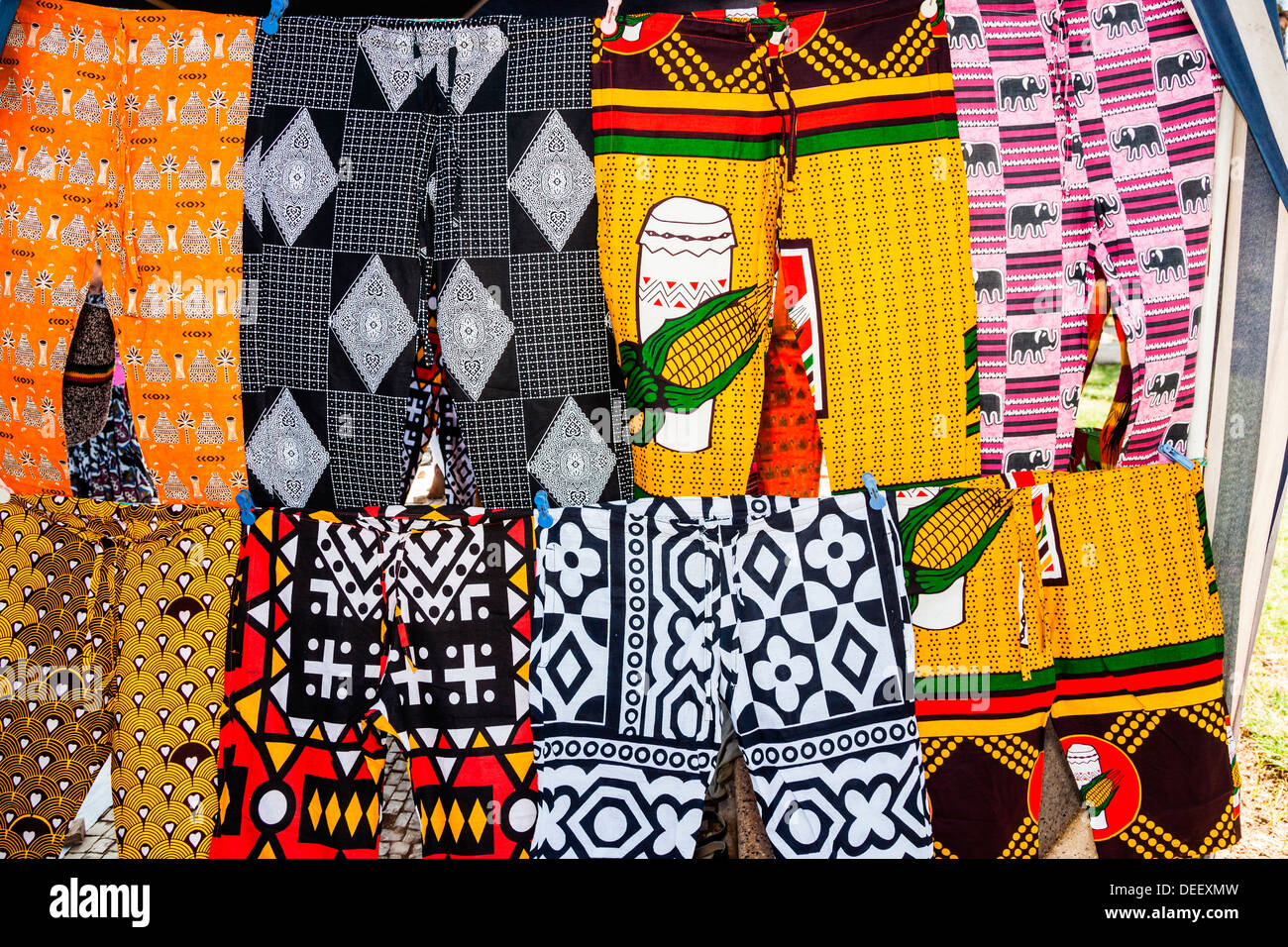 Africa, Angola, Benguela. Brightly colored pants for sale at local shop. Stock Photo