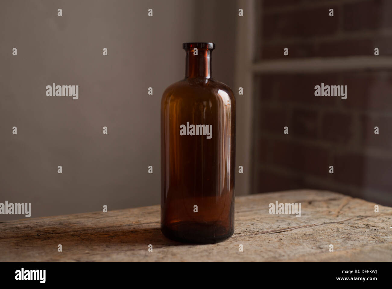 Tall vintage amber bottle Stock Photo