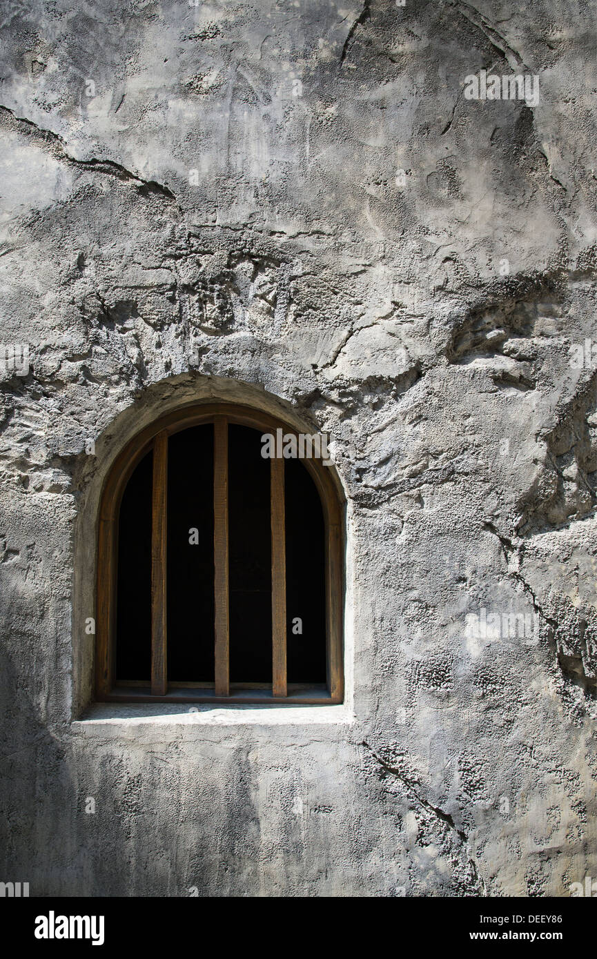 Barred Arch Window Stone Wall Stock Photo