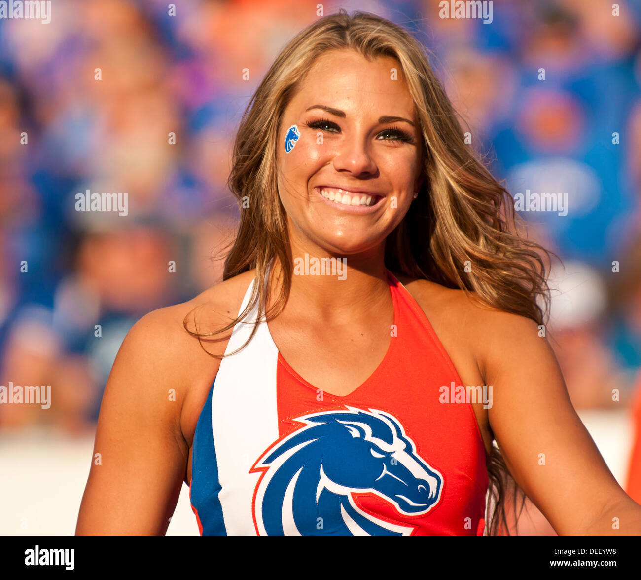 Boise State University cheerleader cheering on the football team at Bronco Stadium in 2013 City of Boise, Idaho Stock Photo