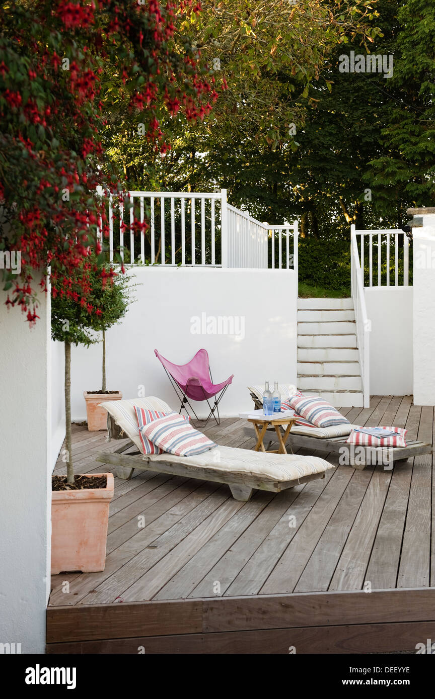 Timber terrace with sunloungers Stock Photo