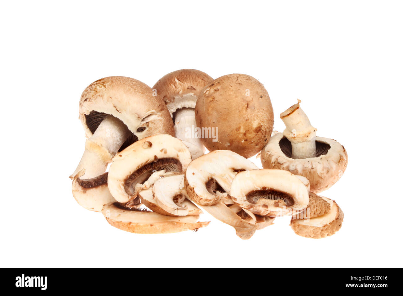 Whole and sliced chestnut mushrooms isolated against white Stock Photo