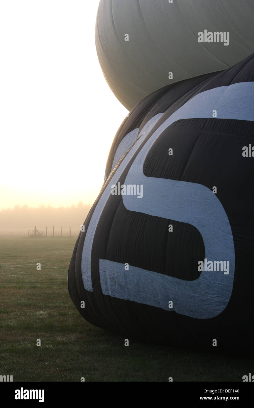 Hot air balloon being inflated Stock Photo - Alamy