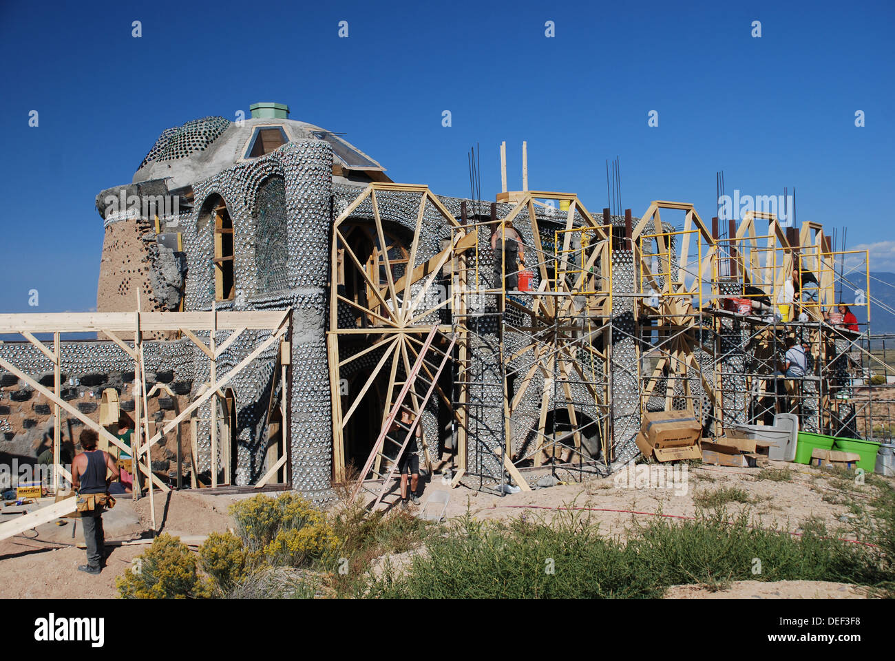 Earthship Green Home using recycled rubber tires and glass bottles in