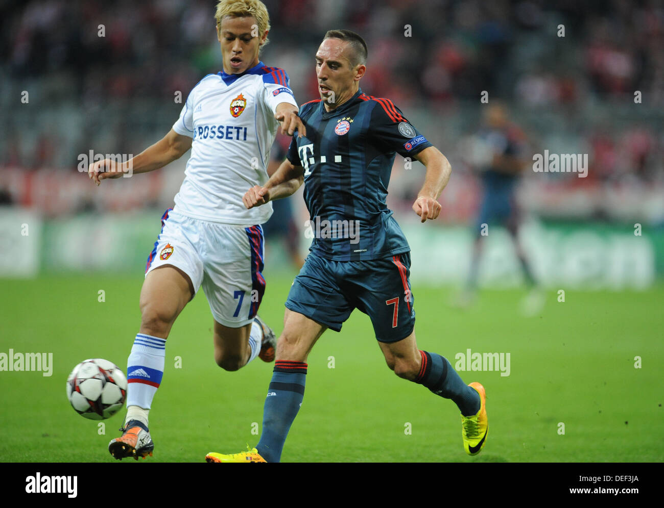 Munich's Franck Ribery (R) and Moscow's Keisuke Honda vie for the ball during the UEFA Champions League Group D soccer match between FC Bayern Munich and CSKA Moscow at München Arena in Munich, Germany, 17 September 2013. Photo: Andreas Gebert/dpa Stock Photo