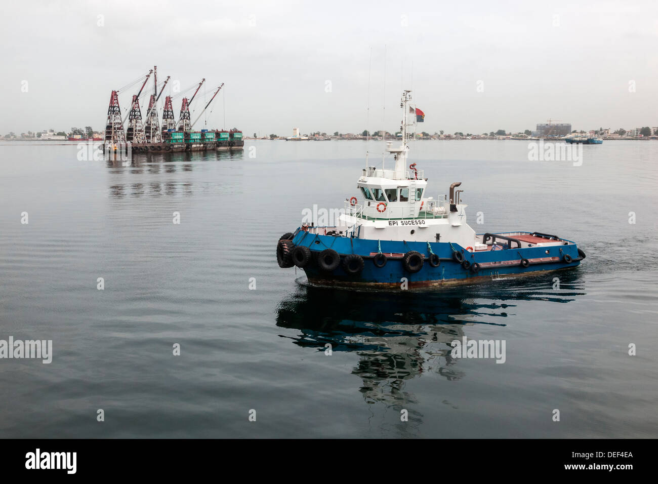 Africa, Angola, Luanda. Tug boat near barge Stock Photo Alamy