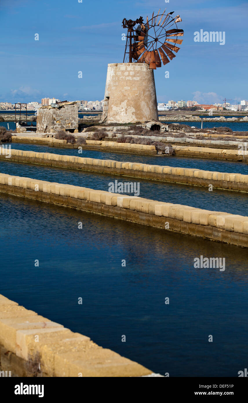 Windmill of Trapani Salt Pans in Trapani in the Province of Trapani, Sicily. Stock Photo