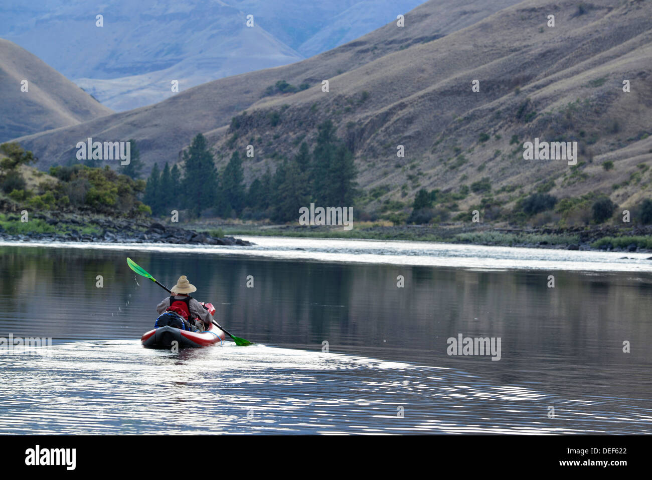 Paddling an inflatable kayak on a calm section of Idaho's Lower Salmon River. Stock Photo