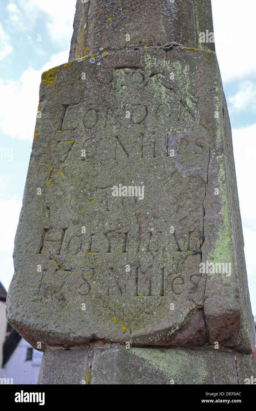 Ancient milestone cross showing mileage to London & Holyhead, Dunchurch, Warwickshire, England, United Kingdom Stock Photo