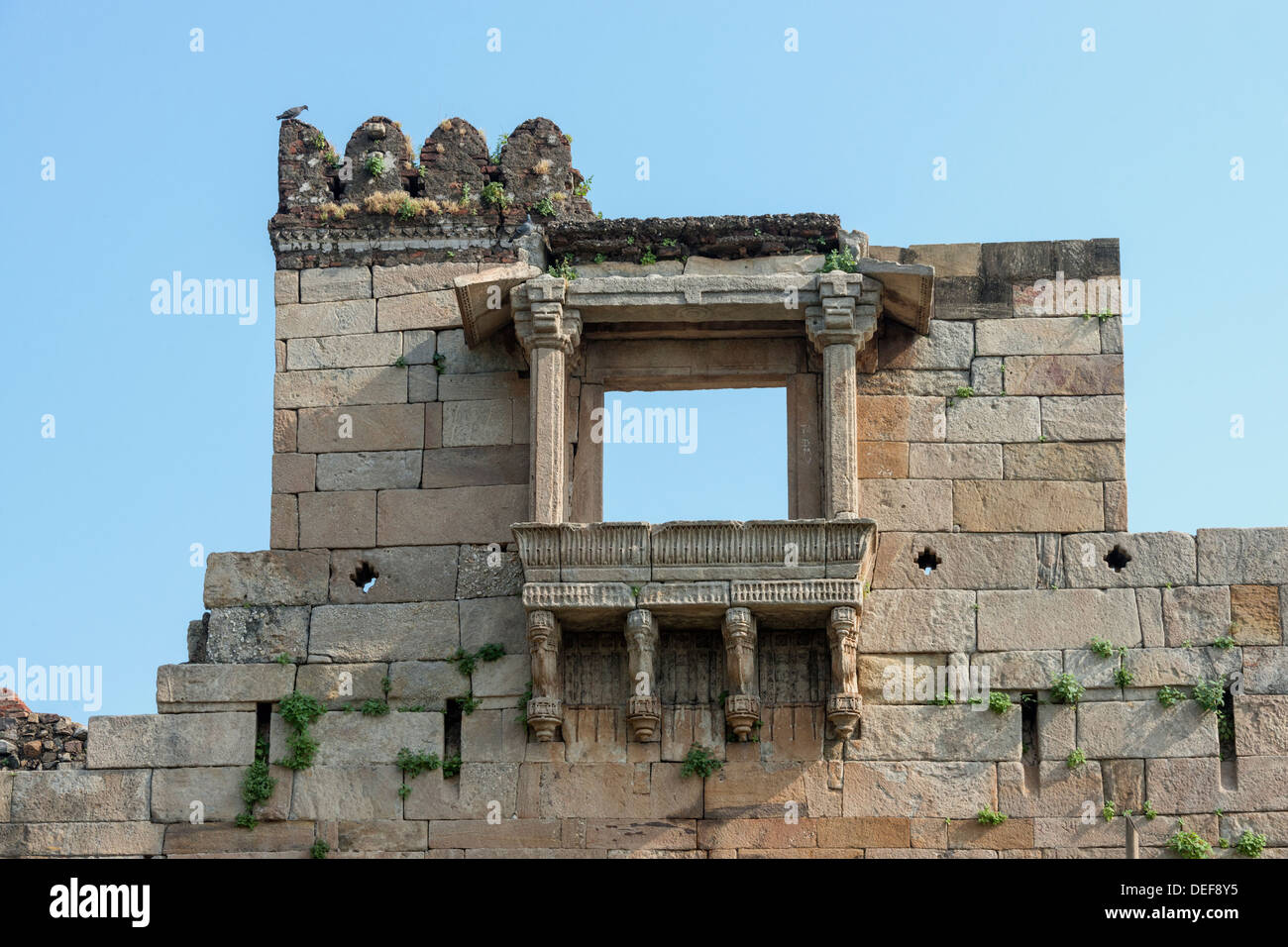 Window (jharokha) in the fortress wall surrounding the Champaner archaeological site, Gujurat State, India Stock Photo
