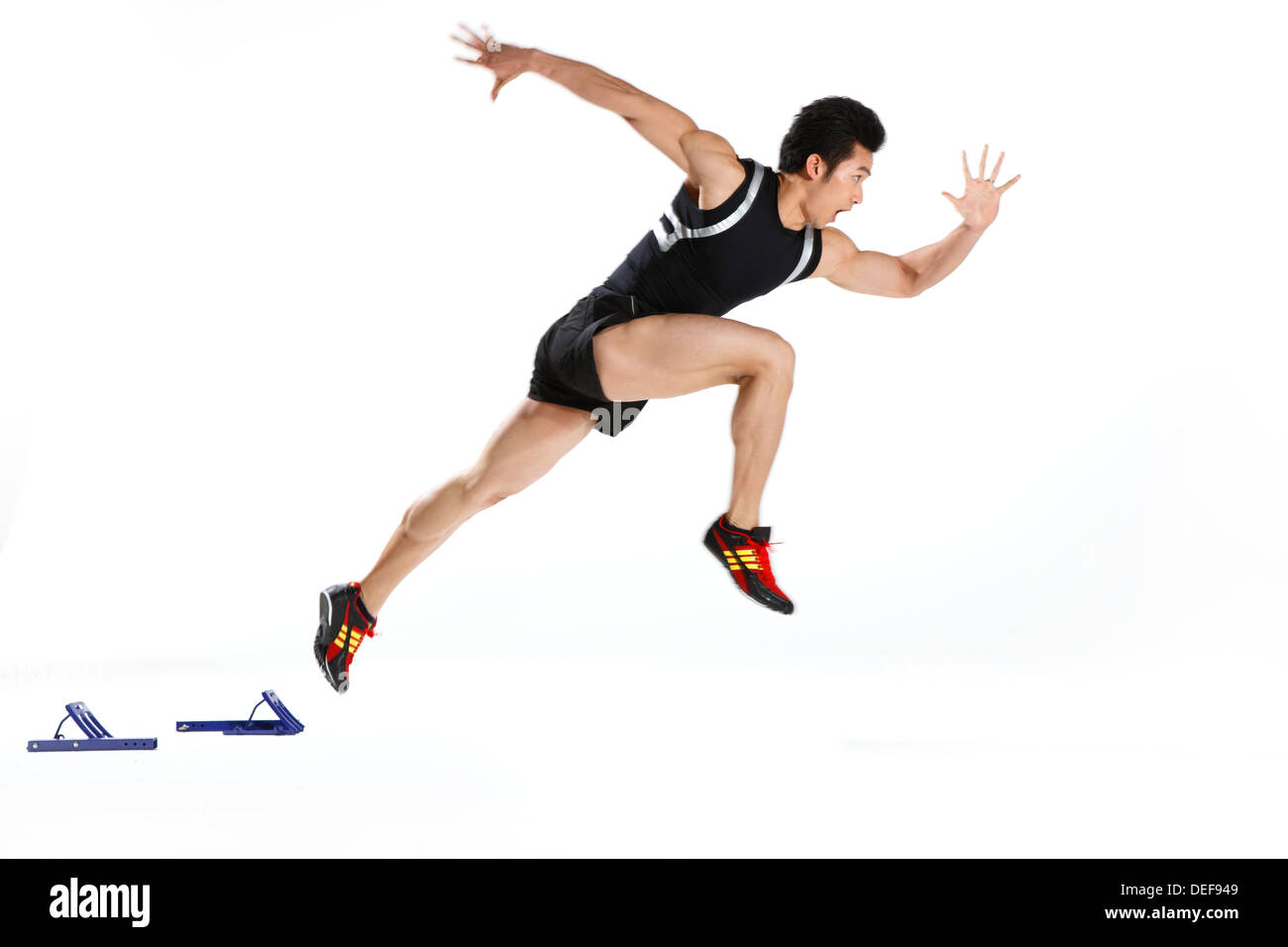 Male runner in starting blocks, side view Stock Photo Alamy