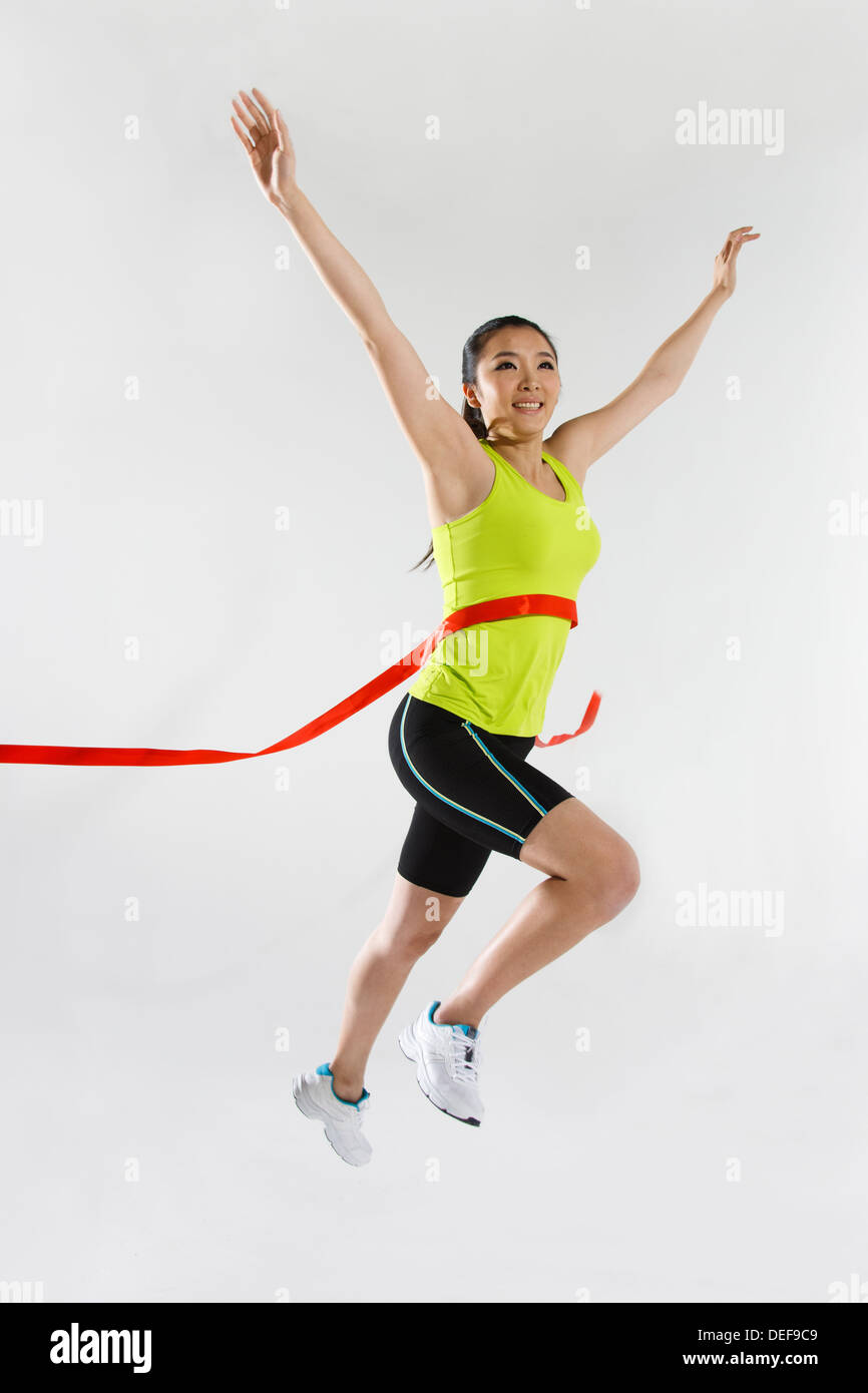 Young woman with finish line Stock Photo - Alamy