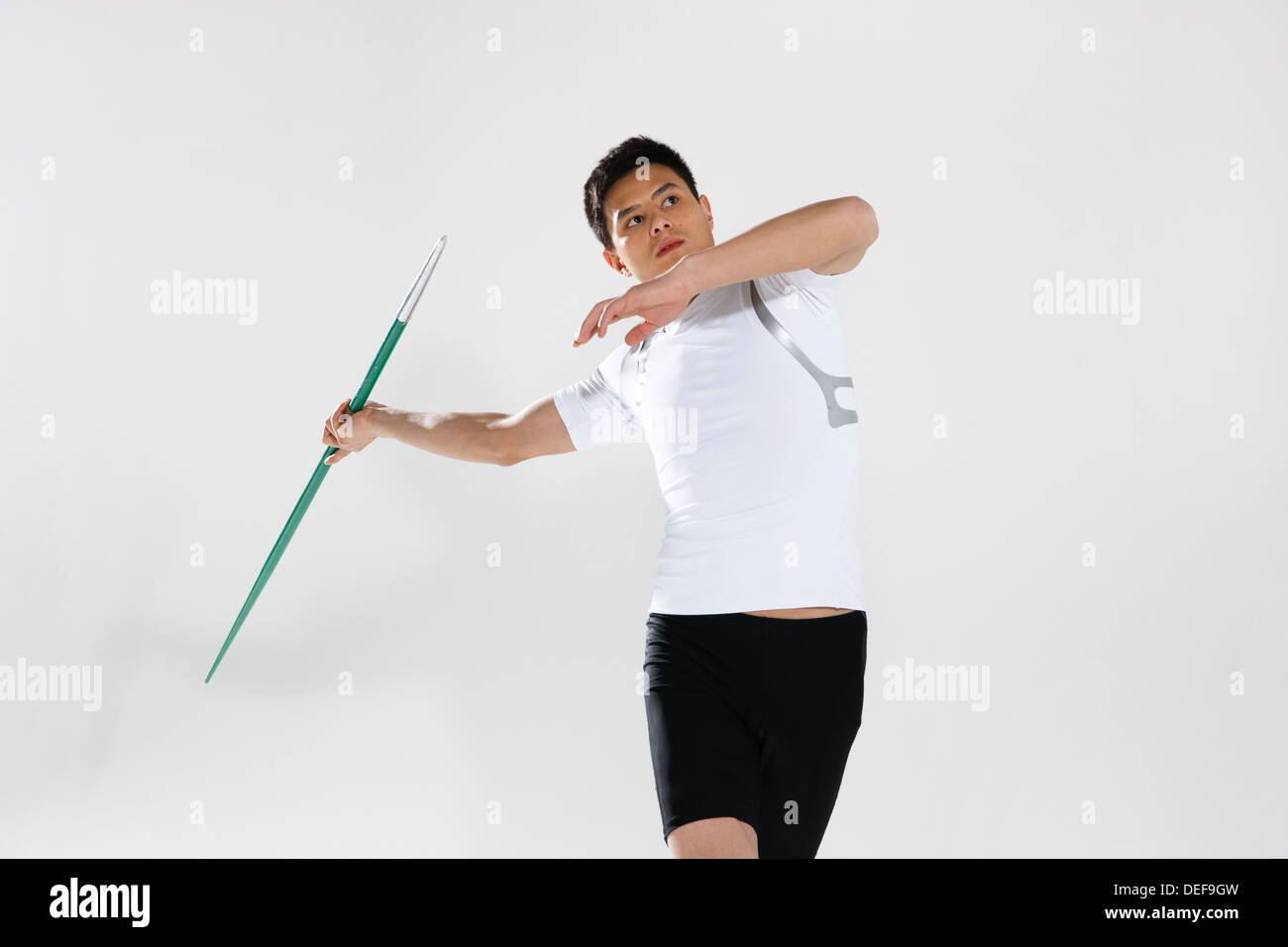 Male track athlete preparing to throw javelin Stock Photo Alamy