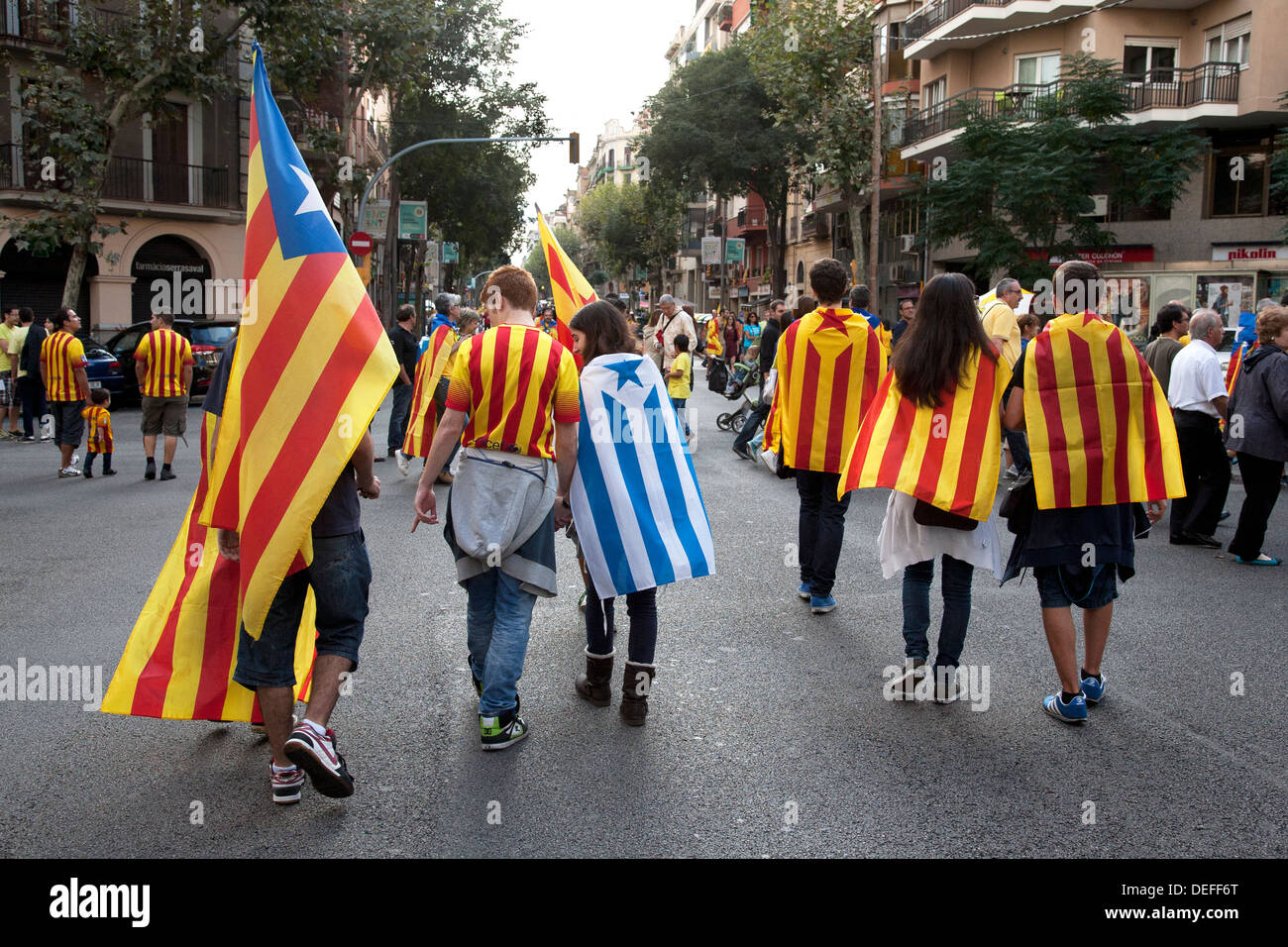 Young Catalans carrying the Catalan independence flag, Barcelona, Spain. Stock Photo