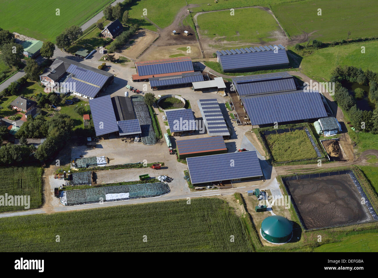 Farm with solar panels on the roofs, aerial view, Fischerhütte, Steenfeld, Schleswig-Holstein, Germany Stock Photo