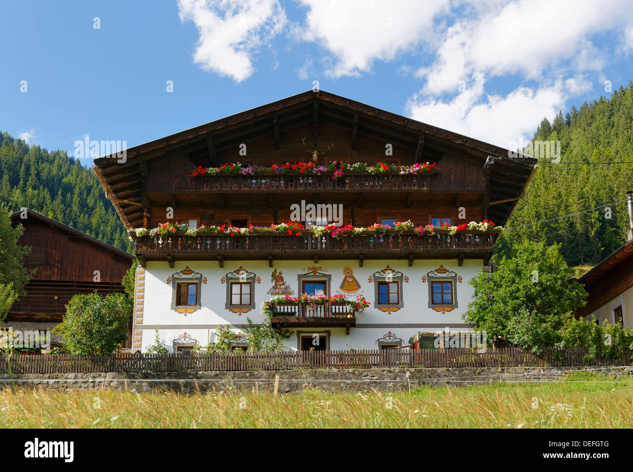 Old farmhouse with mural paintings, Maria Luggau, Lesachtal, Hermagor District, Carinthia, Austria Stock Photo