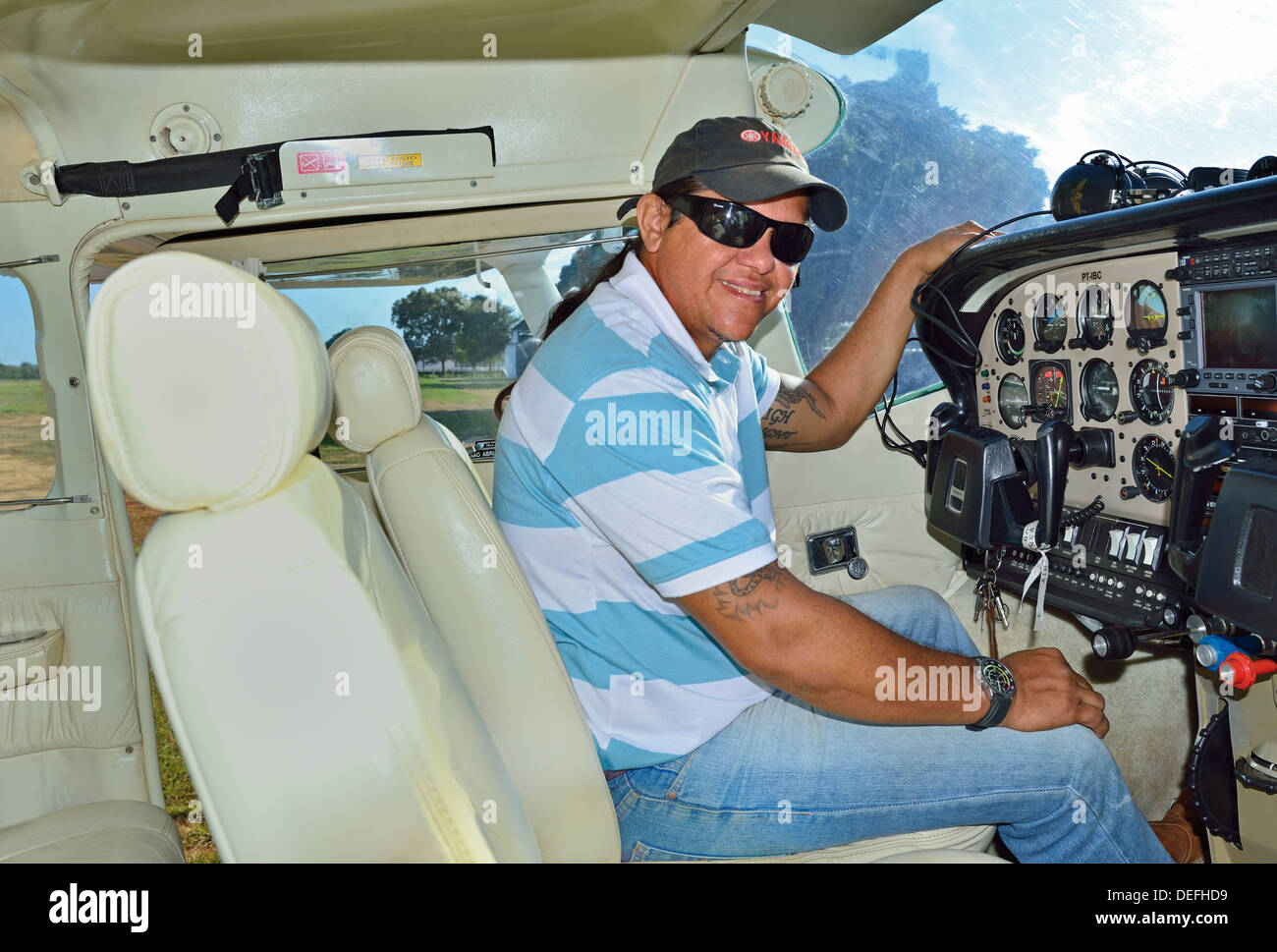 Brazil, Pantanal: Julio Andre Monteiro (Julinho) in a Cessna ready for departure Stock Photo