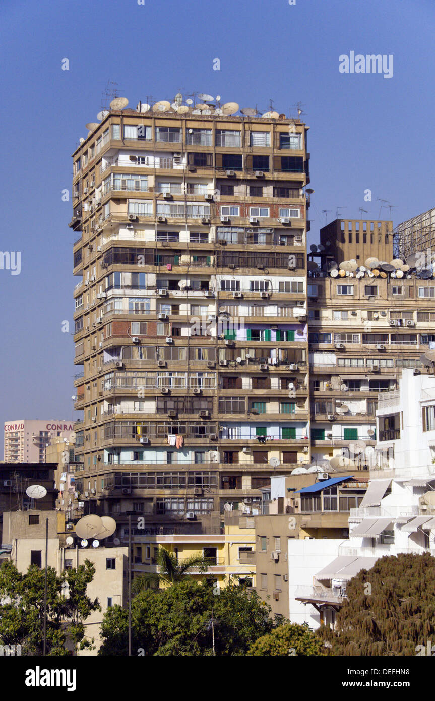 A high rise apartment complex in Zamalek with satellite TV dishes on the roof tops in Cairo