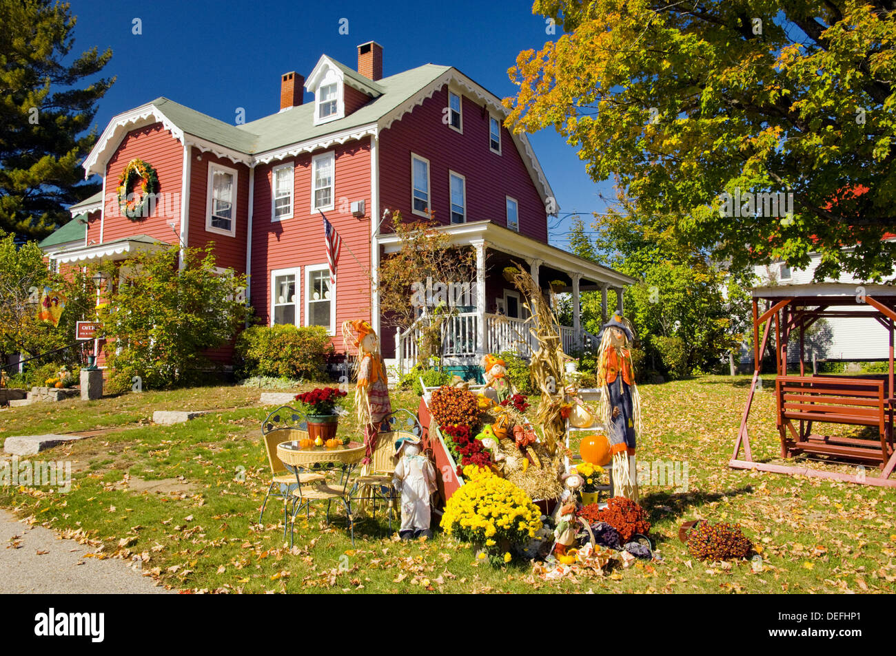 Autumn Yard Decor With Pumpkins Corn Stalks And Scarecrows At The