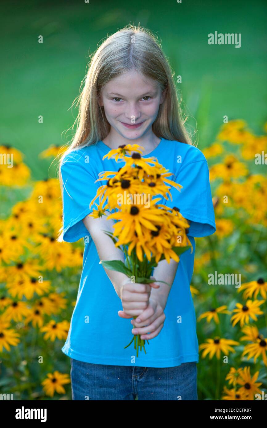 girl with bouquet of black eyed susans Stock Photo Alamy
