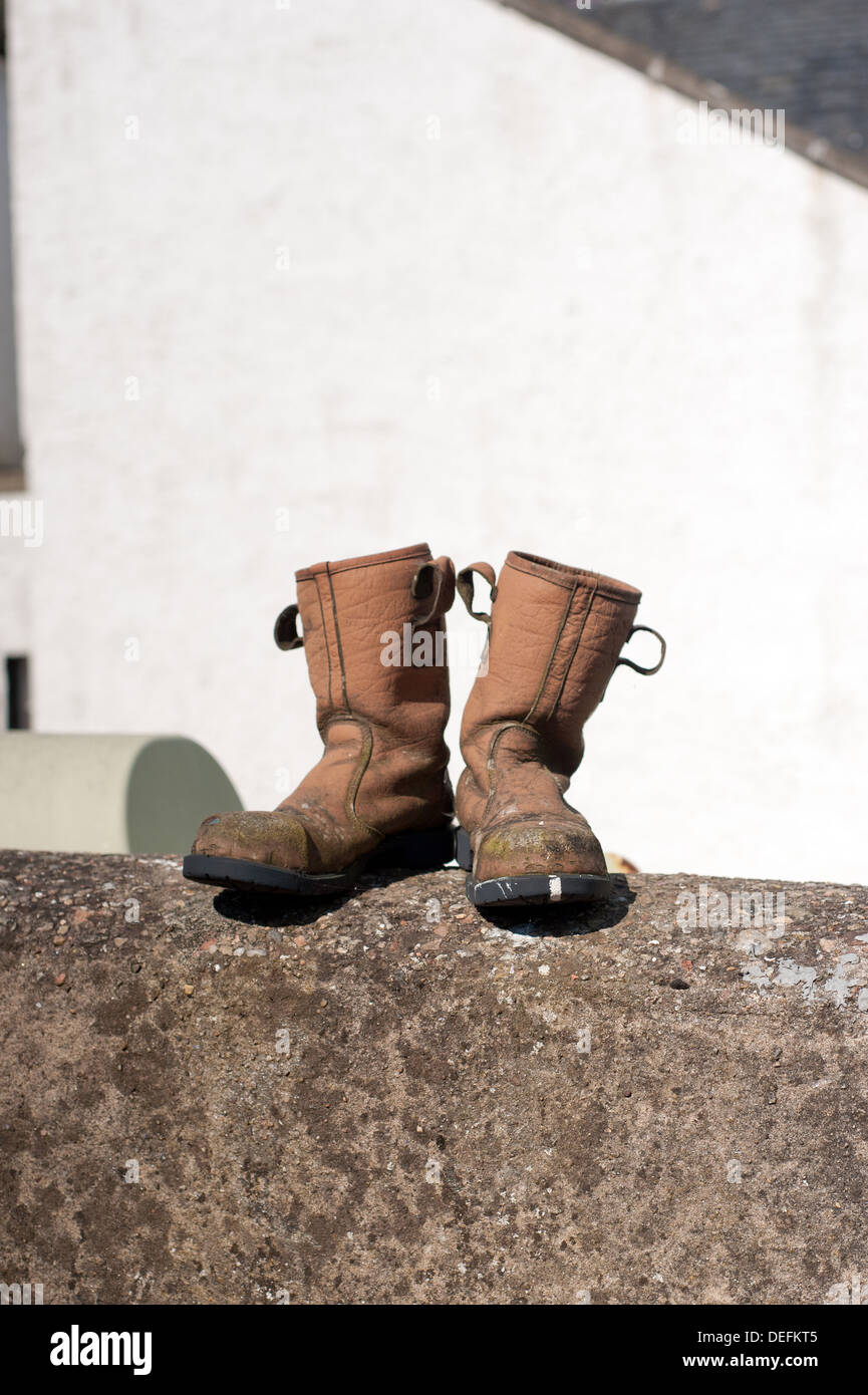 Fisherman's boots drying in the summer sun. Stock Photo