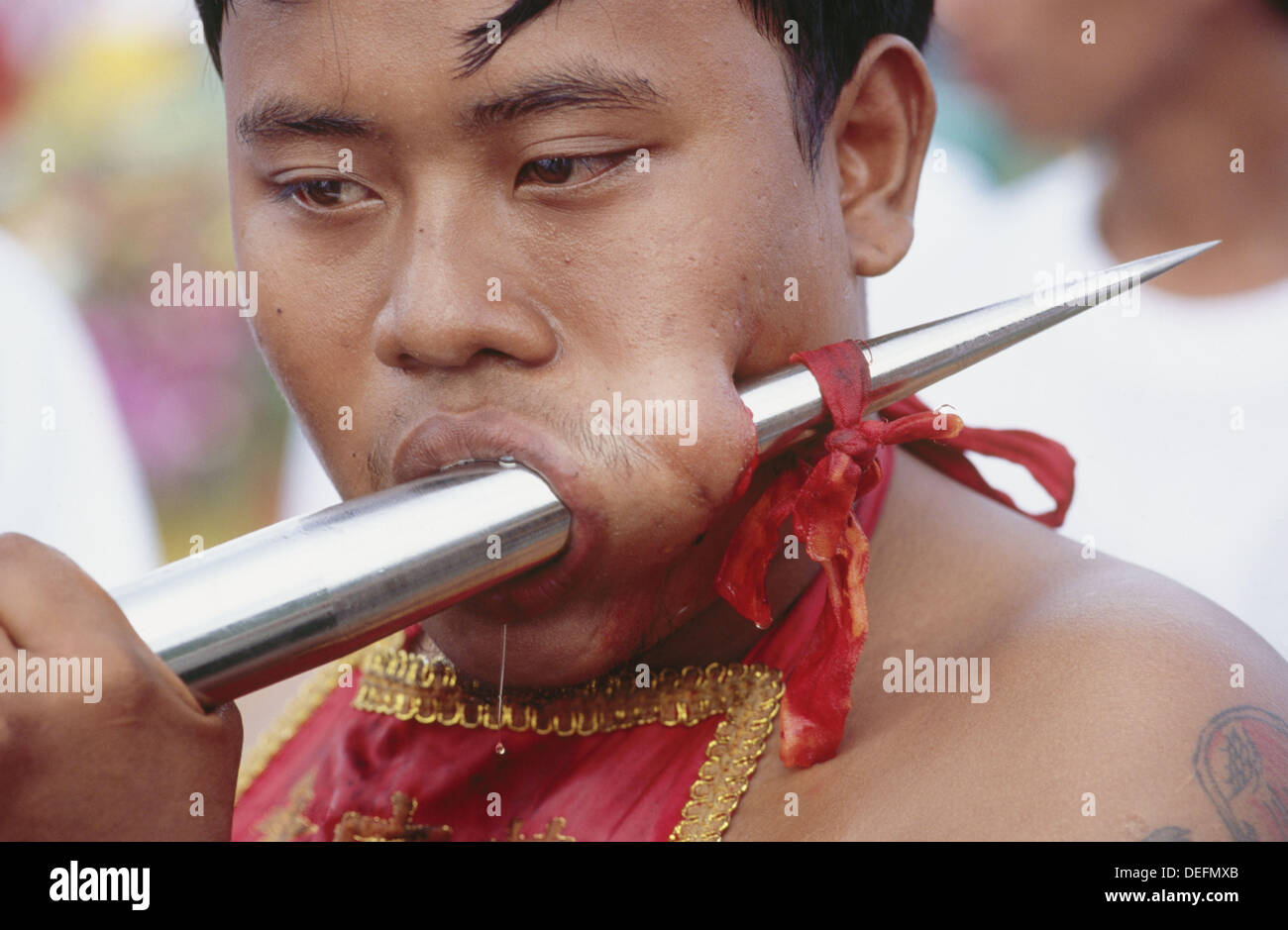 Self torturing spirit medium at the Vegetarian Festival. Phuket. South Tahiland Stock Photo