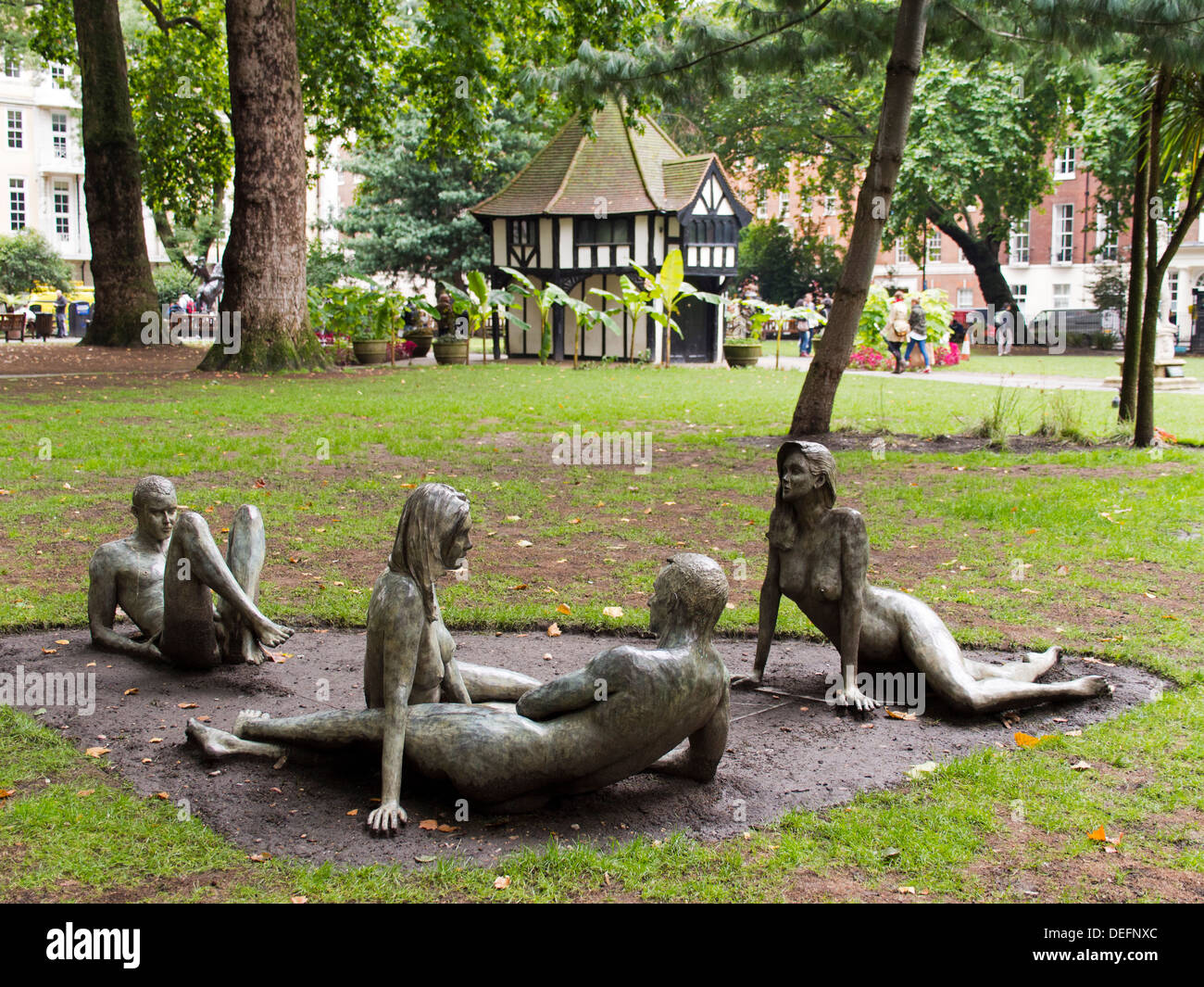 Sculpted group of figures by Bruce Denny in Soho Square, London 2 Stock Photo