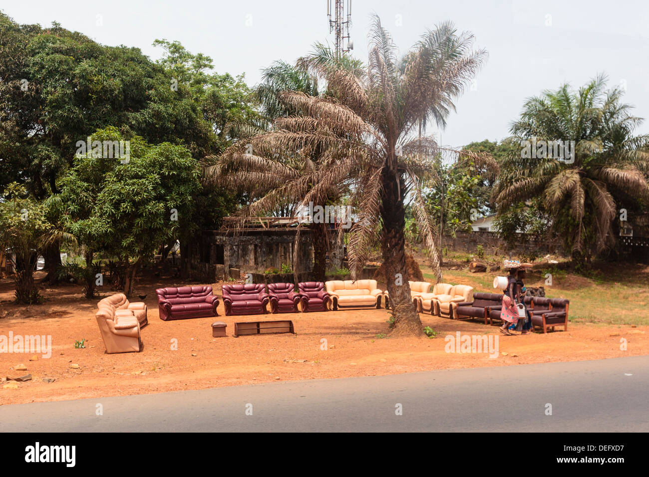 Africa, Liberia, Monrovia. Couches and chairs for sale along roadside. Stock Photo