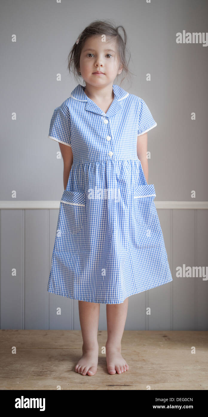 Young girl wearing uniform on first day of school Stock Photo