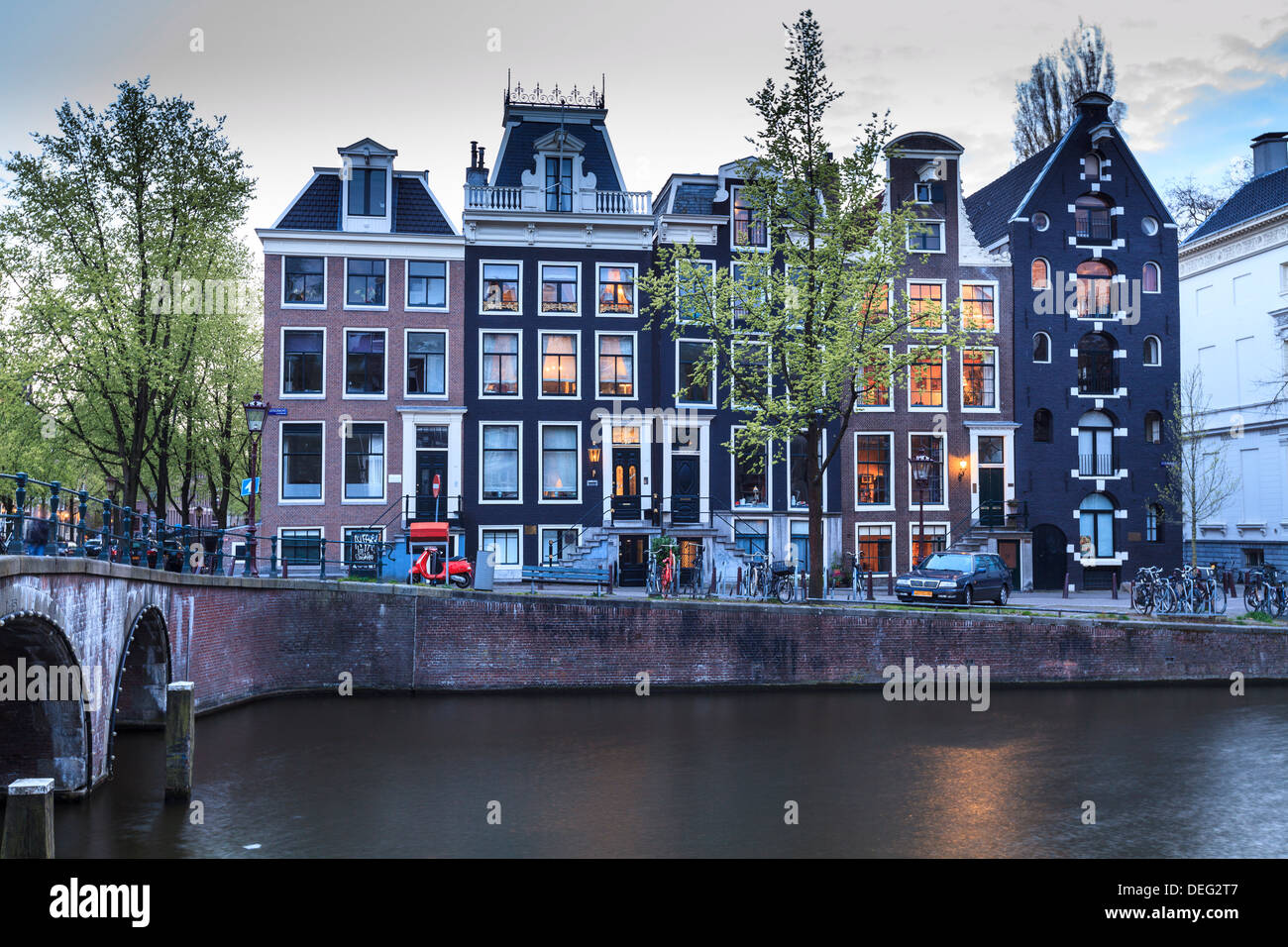 Old gabled houses line the Keizersgracht canal at dusk, Amsterdam, Netherlands, Europe Stock Photo