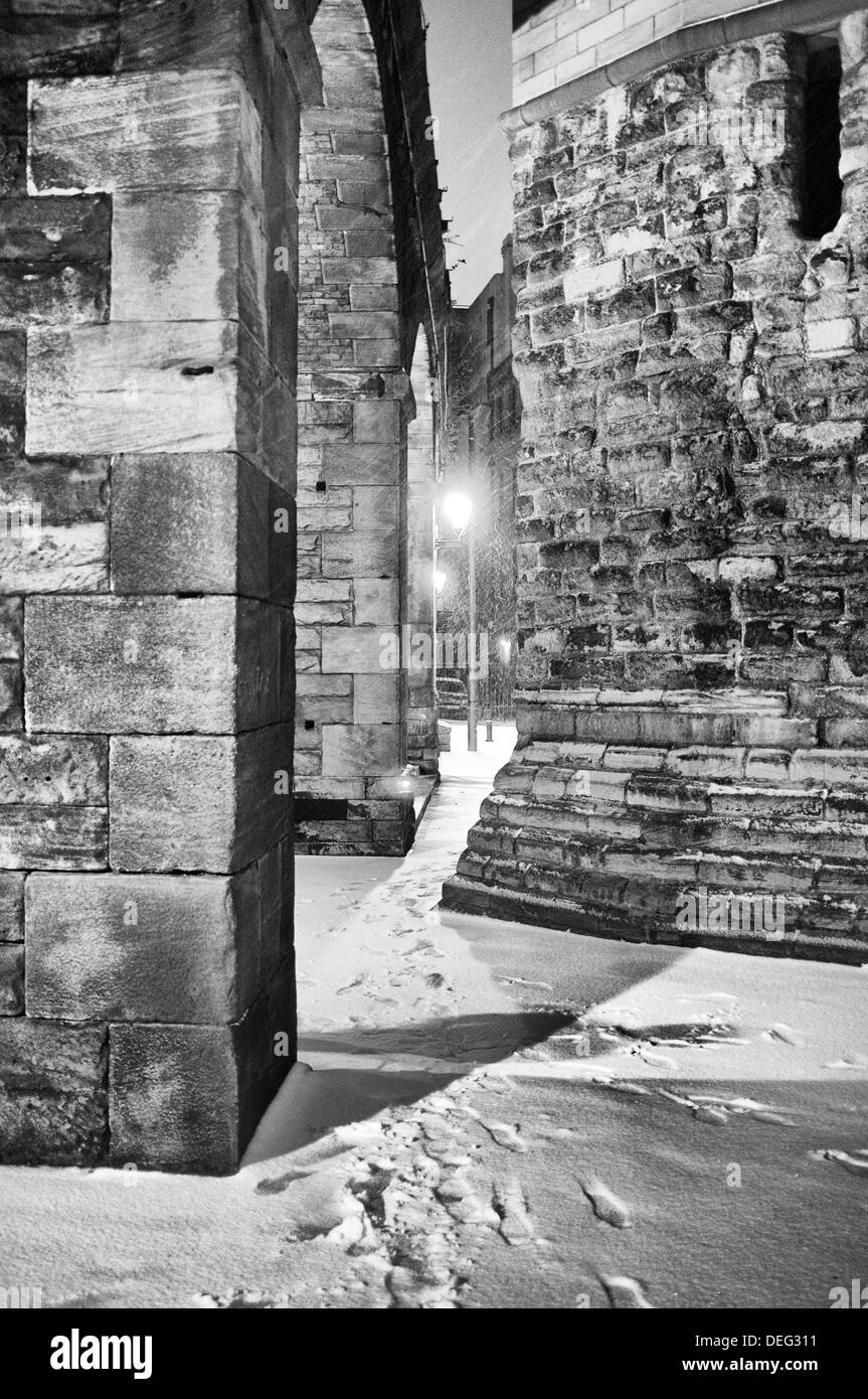 The Castle Keep in Newcastle upon Tyne with the shadow of a man walking in the snow. Taken winter 2012/13 Stock Photo