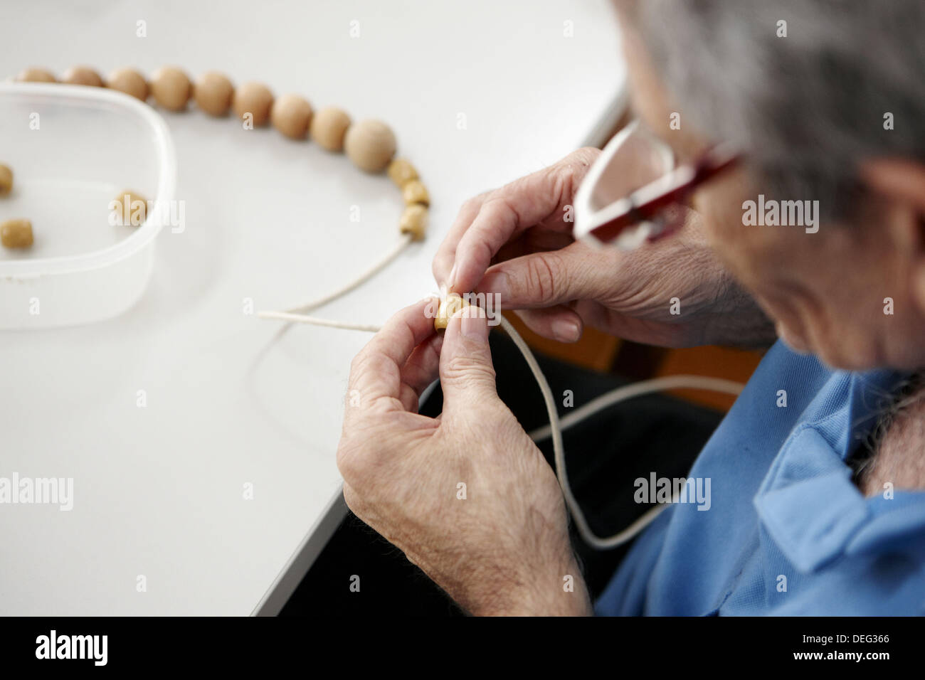 Occupational therapy, beads and string coordination exercise. Hospital