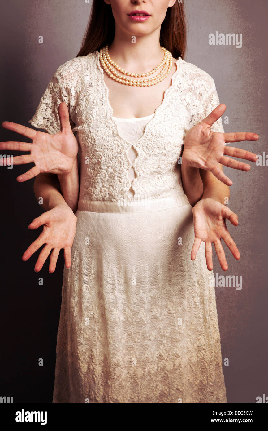 Woman in Pale Lace Dress with Man's Hands Stock Photo