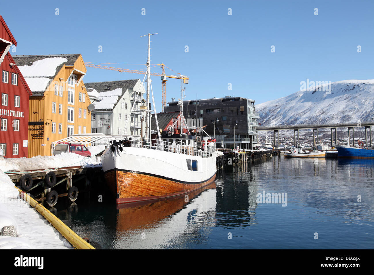 The whaler that used to go to Svalbard, with warehouses behind that have been converted into offices, Tromso, Troms, Norway Stock Photo
