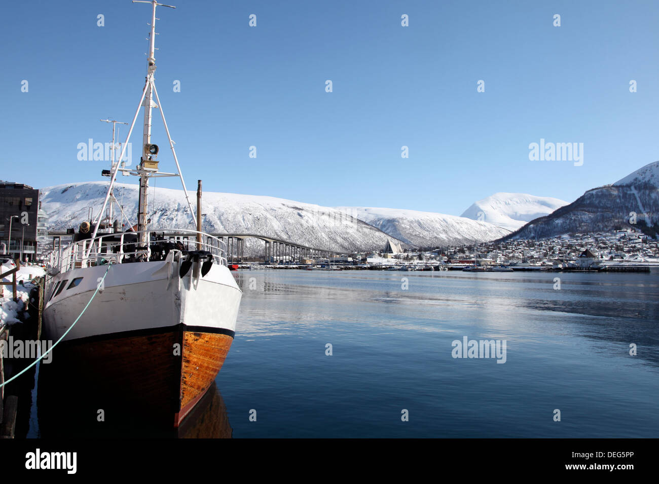 Whaler in Tromso harbour with the Bridge and Cathedral in background, Tromso, Troms, Norway, Scandinavia, Europe Stock Photo