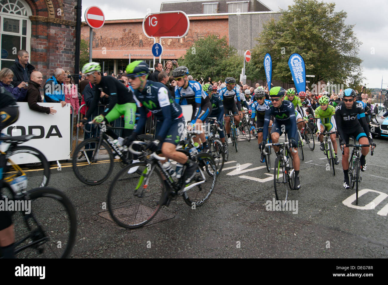 Cyclists at the Tour Of Britain 2013 start line, at Stoke On Trent just setting off. Stock Photo