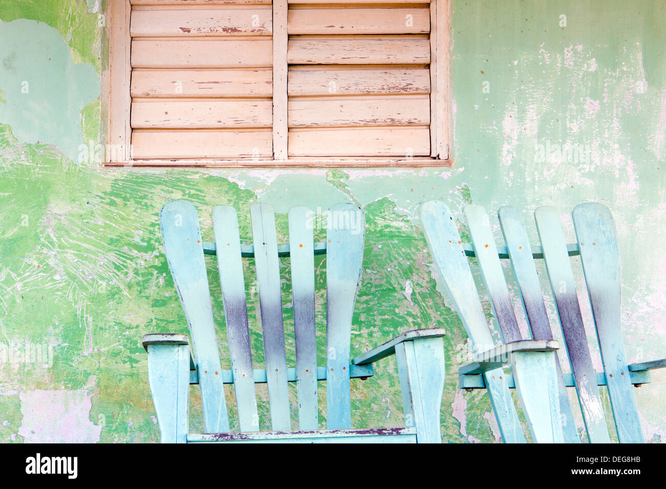 Wall and rocking chair with faded paintwork in the small town of Vinales, Pinar Del Rio Province, Cuba, West Indies Stock Photo