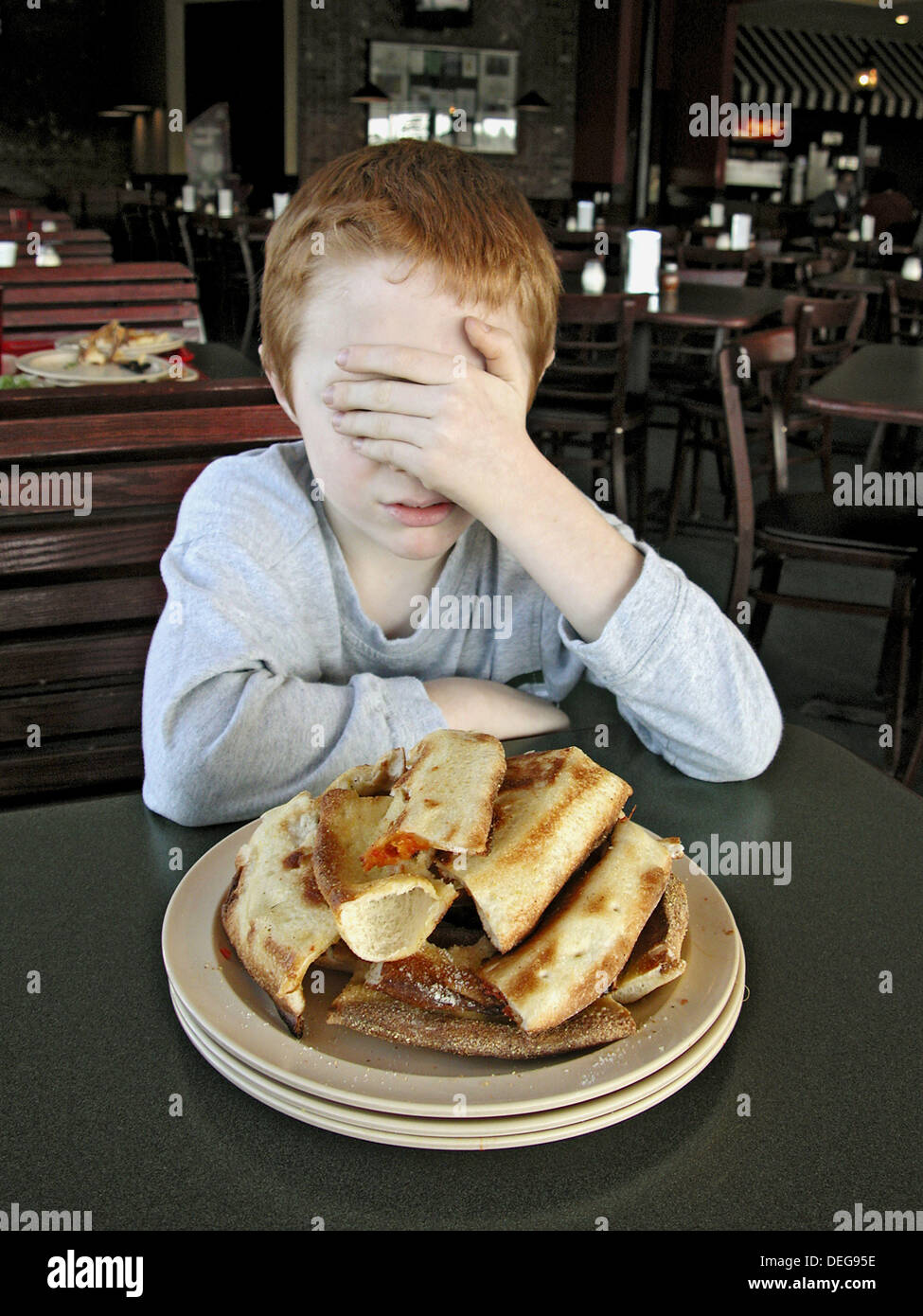 7 year old eating too much pizza Stock Photo Alamy