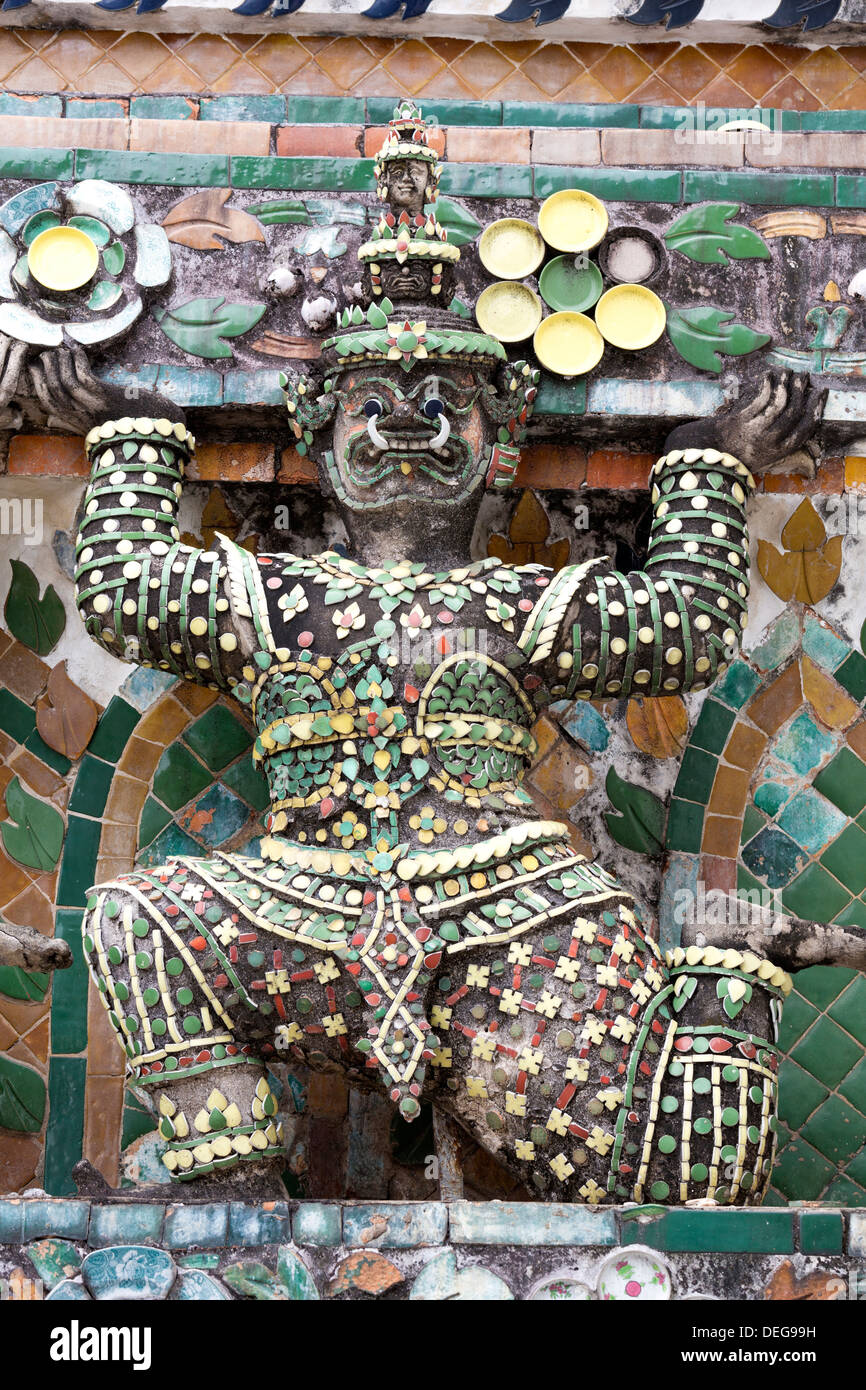 Detail of the Central Prang showing demon figures and ceramic decoration, Wat Arun, Bangkok, Thailand Stock Photo