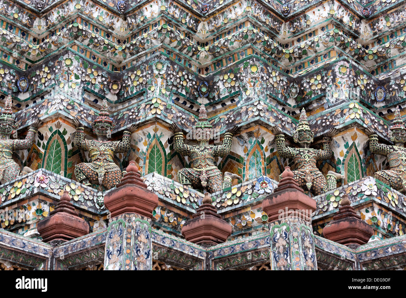 Detail of the Central Prang showing demon figures and ceramic decoration, Wat Arun, Bangkok, Thailand Stock Photo