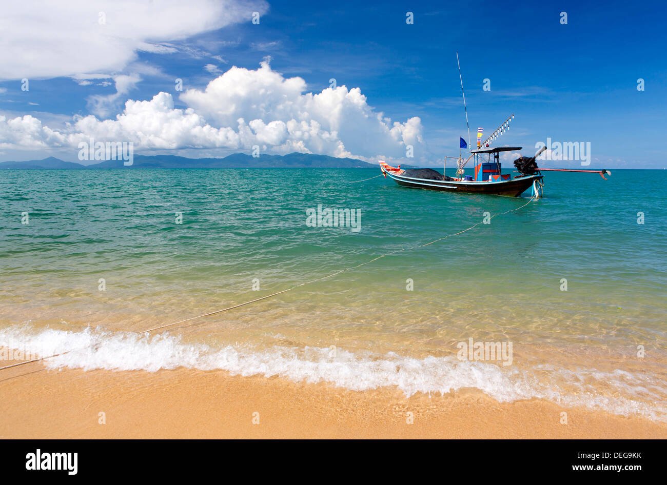 Traditional long-tailed fishing boat moored off Maenam Beach on the North Coast of Koh Samui, Thailand, Southeast Asia, Asia Stock Photo