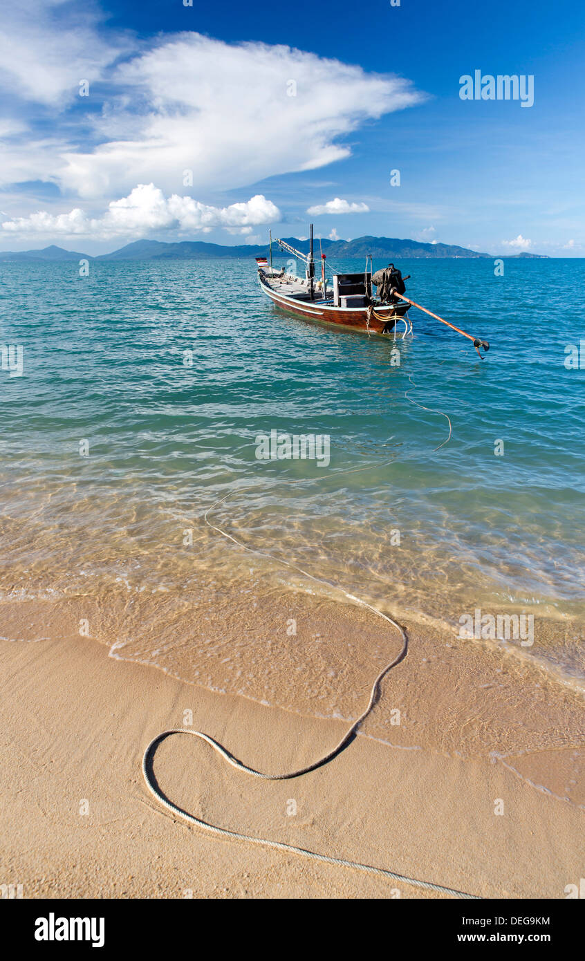 Traditional long-tailed fishing boat moored off Maenam Beach on the North Coast of Koh Samui, Thailand, Southeast Asia, Asia Stock Photo