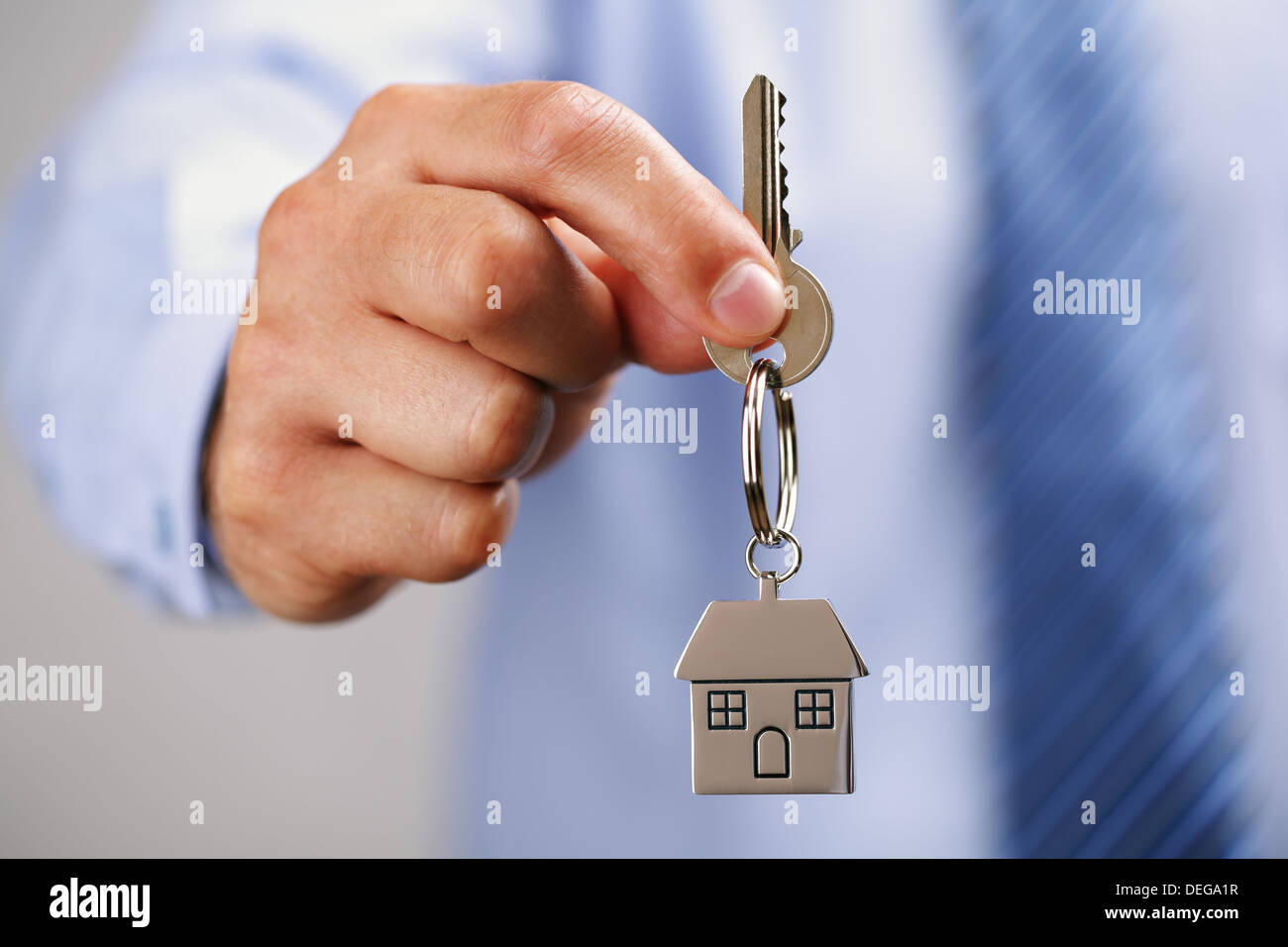 Giving house keys Stock Photo