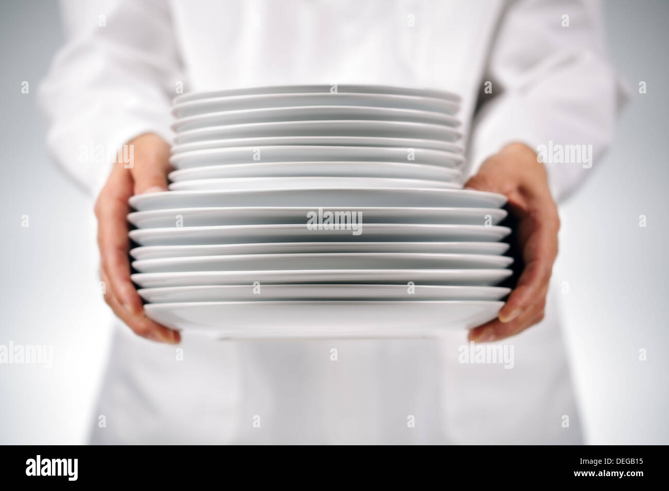 Holding plates Stock Photo
